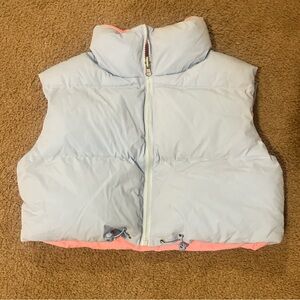 small blue winter puffer vest with pink insides